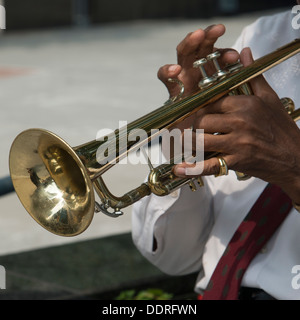 Mid section view of a man playing a trumpet, Chicago, Cook County, Illinois, USA Stock Photo