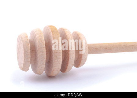 Wooden spoon for honey on a white background. Stock Photo