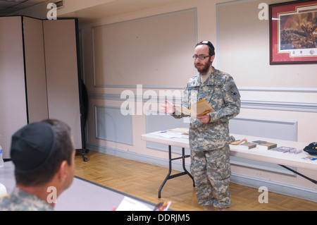 Soldiers present for the pre-Rosh Hashanah service learned more about Jewish customs, prayers, and religious symbols. Maryland Defense Force Chaplain (Capt.) Chesky Tenenbaum, the first bearded defense force chaplain of any state, held a pre-Rosh Hashanah Stock Photo