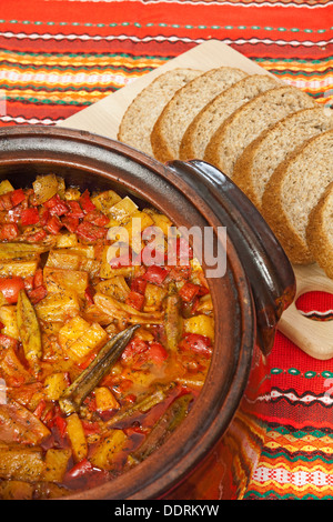 Bulgarian national dish - vegetable stew prepared and served in a ceramic pot Stock Photo