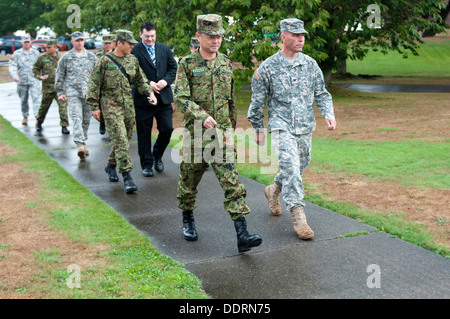 Maj. Gen. Omori (left), deputy commanding general, 4th Division, Northern Army, Japan Ground Self-Defense Force, walks alongside Col. Hugh D. Bair, commander, 3rd Stryker Brigade Combat Team, 2nd Infantry Division, during a recent visit Sept. 3, 2013. Sol Stock Photo