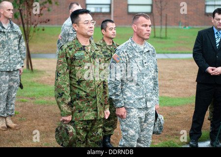 Maj. Gen. Omori (left), deputy commanding general, 4th Division, Northern Army, Japanese Ground Self-Defense Force, stands alongside Col. Hugh D. Bair, commander, 3rd Stryker Brigade Combat Team, 2nd Infantry Division, at a wreath laying ceremony held at Stock Photo