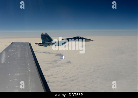 A Russian Federation Air Force Su-27 Sukhoi intercepts a simulated hijacked aircraft entering Russian airspace Aug. 27, 2013, at Exercise Vigilant Eagle 13. This exercise is the fifth in a series of cooperative exercises that provide an opportunity for Ru Stock Photo