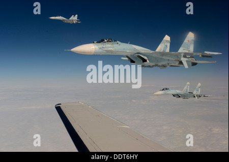 Russian Federation Air Force Su-27 Sukhois intercepts a simulated hijacked aircraft entering Russian airspace Aug. 27, 2013, at Stock Photo