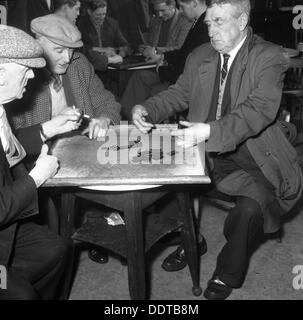 A game of dominoes in a miners' welfare club, Horden, County Durham, 1963. Artist: Michael Walters Stock Photo