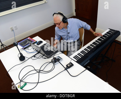 Yale Professor of Music Craig Wright teaches his online 'Listening to Music' class, with students from all over the world. Stock Photo