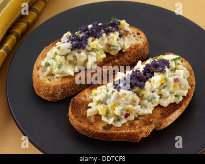 Egg fennel salad with caviar on sourdough toast Stock Photo