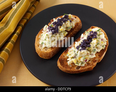 Egg fennel salad with caviar on sourdough toast Stock Photo