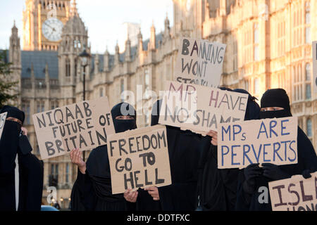 London, UK. 06th Sep, 2013. Muslim women outside the Houses of Parliament wearing Burkas protest against attempts to ban the garment. MPs in Commons are currently debating Philip Hollobone's bill which would make it illegal to wear the clothing. Credit:  Pete Maclaine/Alamy Live News Stock Photo