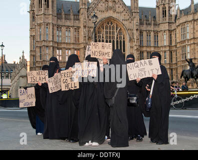 London, UK. 06th Sep, 2013. Muslim women outside the Houses of Parliament wearing Burkas protest against attempts to ban the garment. MPs in Commons are currently debating Philip Hollobone's bill which would make it illegal to wear the clothing. Credit:  Pete Maclaine/Alamy Live News Stock Photo