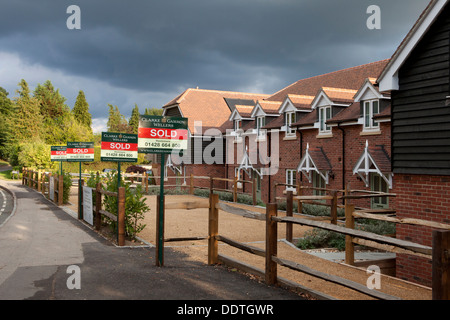 Sold signs outside newly built houses in Hindhead Haslemere Surrey Stock Photo