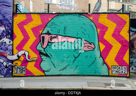 Graffiti by Broken Fingaz in Christina Street, Shoreditch, London, UK. Broken Fingaz is a street artist collective from Israel.