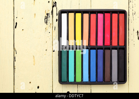 colorful crayons on a wooden background Stock Photo