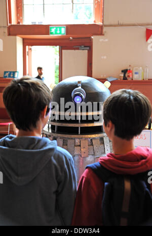 A Dalek from the TV series Dr Who meeting members of the public of all ages at the Mini Maker Faire held in the Corn Exchange Brighton Stock Photo