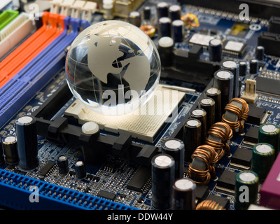 Electronic world (multicolor computer system board with crystal globe) Stock Photo