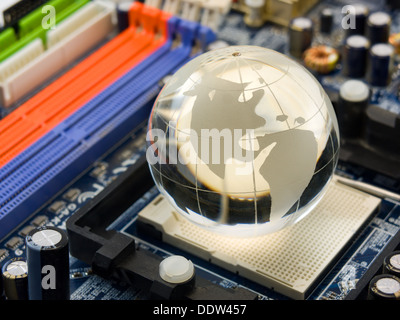 Electronic world (multicolor computer system board with crystal globe) Stock Photo