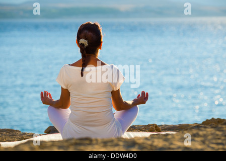healthy middle aged woman doing fitness stretching outdoors