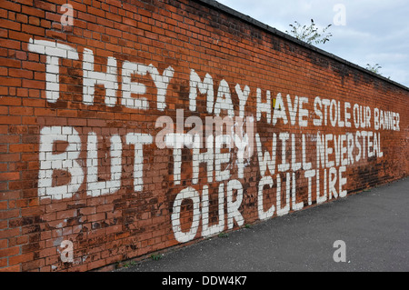 Graffiti 'They may have stole our banner, but they will never steal our culture' Stock Photo