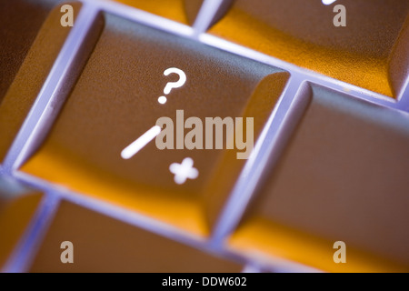 Close up of the question mark on an illuminated computer keyboard Stock Photo