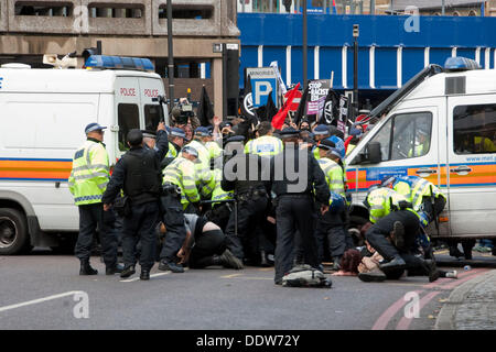 London, UK. 07th Sep, 2013. Police officers clash with anti-fascists as nearby members of the far-right English Defence League march across Tower Bridge in a failed attempt to reach Tower Hamlets. Credit:  Pete Maclaine/Alamy Live News Stock Photo