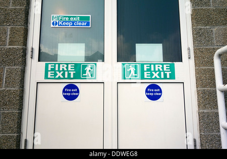 A fire exit door in a industrial building Stock Photo