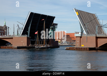 The galeas Anne Marie passes through the open Langebro Bridge in the port of Copenhagen. Stock Photo