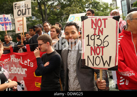 London, UK. 7 September 2013. A demonstrator with placards in reference to the Battle of Cable Street, in Whitechapel, Tower Hamlets, in 1936. Credit: David Mbiyu/ Alamy Live News Stock Photo