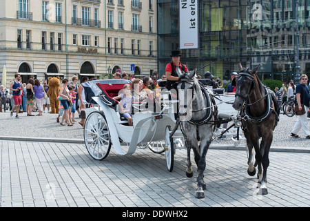 BERLIN - JULY 30: Visitors Center, Berlin - Pariser Platz. The trip tourists on carriage, July 30, 2013, Berlin, Germany Stock Photo