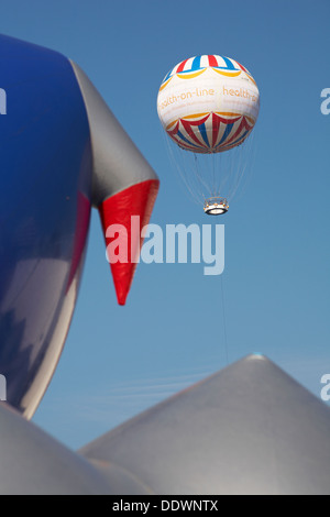 Bournemouth Eye Balloon with part of the exterior of the Amococo Luminarium at Bournemouth in September Stock Photo