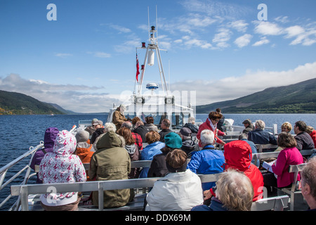 Tourists on Loch Ness cruise boat in Highlands of Scotland Stock Photo