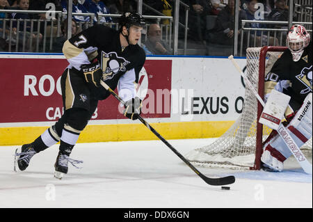 Derrick Pouliot (7) from the Penguins carries the puck up the ice during a game between the Pittsburg Penguins and Toronto Maple Leafs at the 2013 NHL Rookie Tournament being played in London Ontario, Canada on September 7, 2013 at Budweiser Gardens. It took overtime and a shoot-out before the Leafs were able to defeat the Penguins by a score of 4-3. Stock Photo