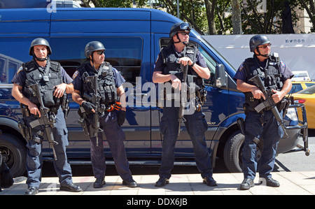 4 New York City policemen on anti terror patrol near Fashion Week at Lincoln Center in New York City Stock Photo