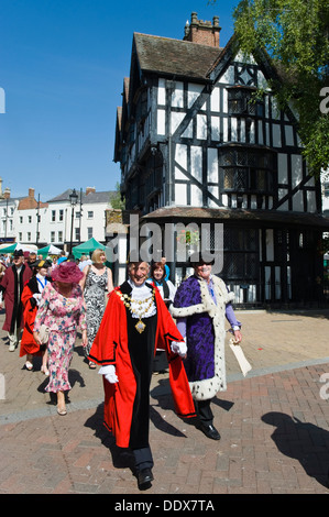 Mayor's civic procession walking past The Old House at High Town in Hereford Herefordshire England UK