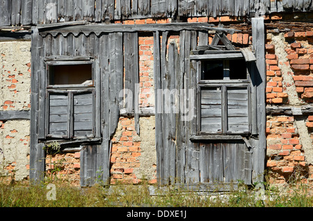 Old broken window on brick wall Stock Photo