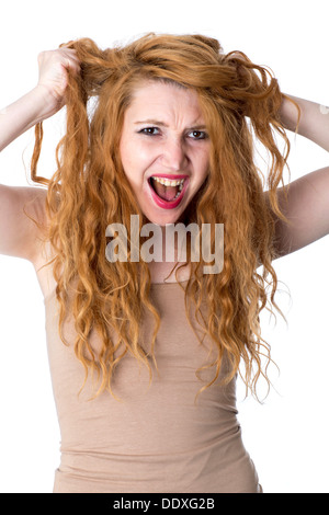 Model Released. Angry Young Woman Tearing Hair Out Stock Photo