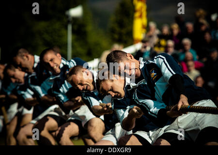 Braemar, Scotland, United Kingdom. September 7th, 2013: A team fights in the tug war competition  during the annual Braemer Highland Games at The Princess Royal and Duke of Fife Memorial Park Stock Photo