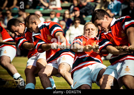 Braemar, Scotland, United Kingdom. September 7th, 2013: A team fights in the tug war competition  during the annual Braemer Highland Games at The Princess Royal and Duke of Fife Memorial Park Stock Photo