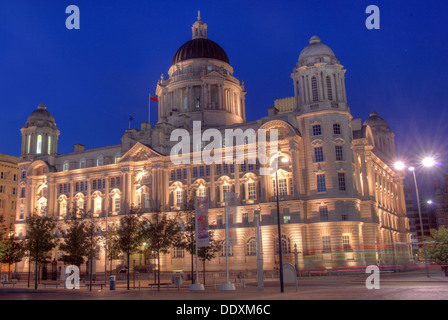 Pier Head Port of Liverpool at Nighttime Merseyside England UK Stock Photo