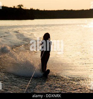 Girl waterskiing in a lake, Lake of The Woods, Keewatin, Ontario, Canada Stock Photo