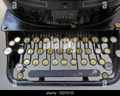 Old classic victorian typewriter machine. Black with ivory keys Stock Photo