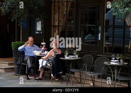 Two People Taking Afternoon Tea, Monmouth Street, Covent Garden, London, England Stock Photo