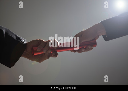 Close-up of hands holding a baton Stock Photo