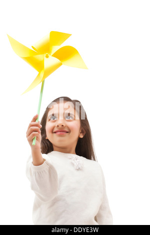 Young girl holding a toy windmill Stock Photo