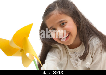 Portrait of a girl with a toy windmill Stock Photo