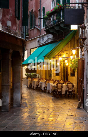 Restaurant in an alley at night Stock Photo