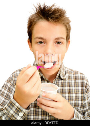 Portrait, boy, teenager eating yoghurt Stock Photo