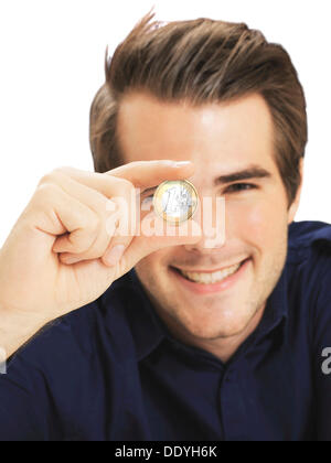 Businessman holding euro coin Stock Photo