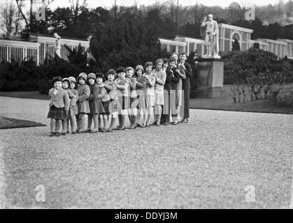 Cavendish family group of 16 grandchildren in the gardens of Chatsworth, Derbyshire, 1930. Artist: JR Board Stock Photo