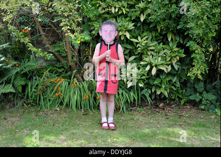 little girl wearing wayne rooney mask Stock Photo