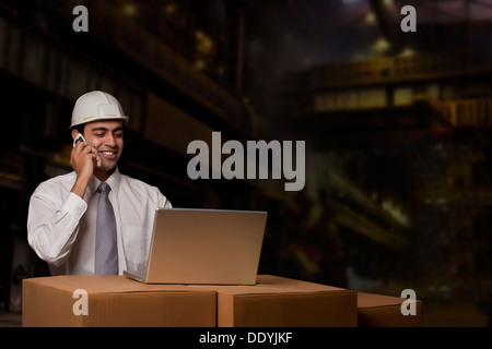 Engineer talking on a mobile phone Stock Photo